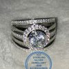 "925 Sterling Silver Statement Ring with large round halo and 5 bands of which 3 with cubics all as 1 ring"