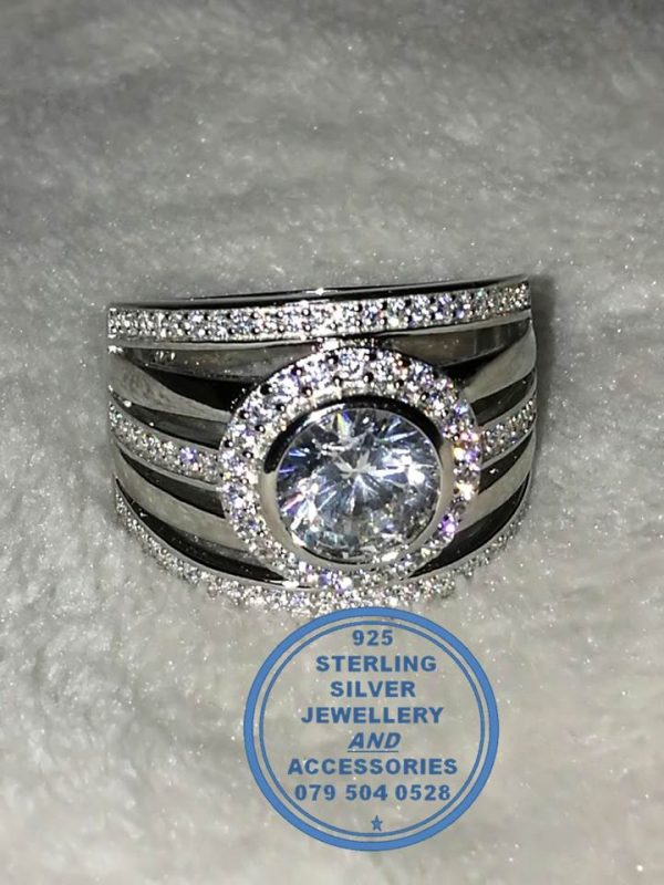 "925 Sterling Silver Statement Ring with large round halo and 5 bands of which 3 with cubics all as 1 ring"