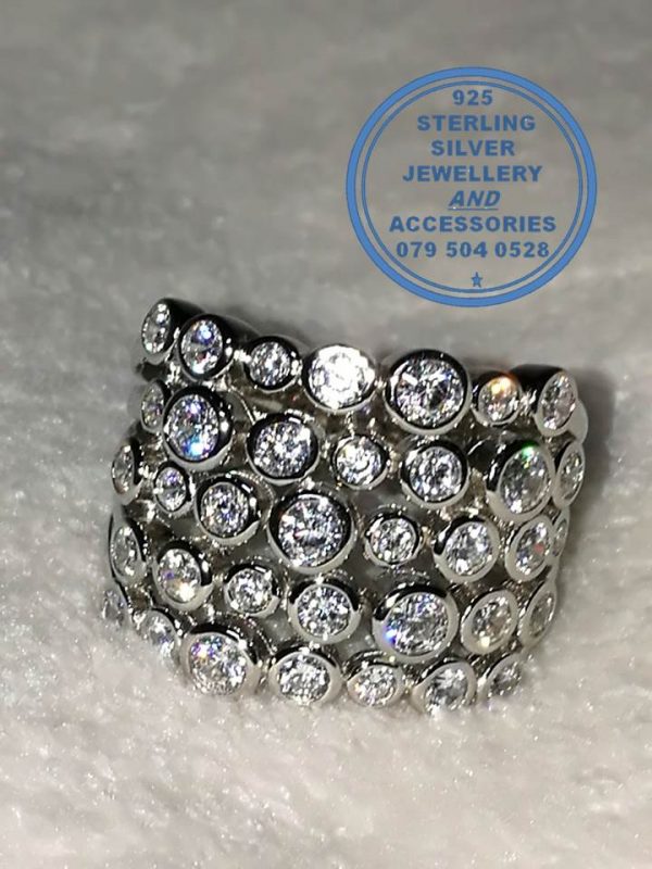 925 Sterling Silver Ring with 5 bands as 1 with multiple tube set cubics per row. Bold Statement. Stunner
