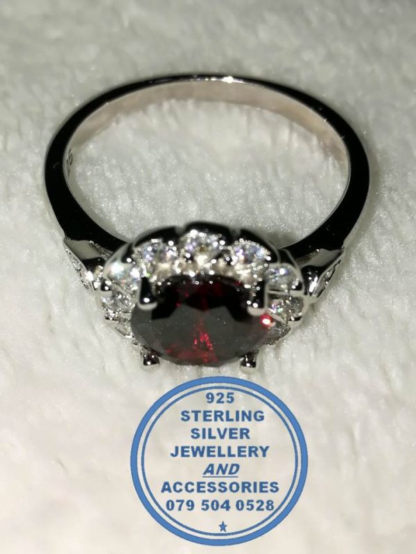 "925 Sterling Silver Ring with round Red Cubic with clear cubic setting around"