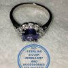 "925 Sterling Silver Ring with round Blue Cubic with clear cubic setting around"