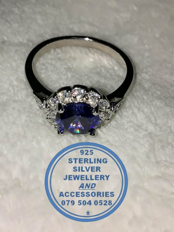 "925 Sterling Silver Ring with round Blue Cubic with clear cubic setting around"