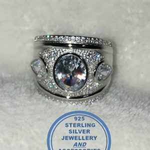 "925 Sterling Silver Ring with large cubic oval in middle with 2 teardrop cubics 1 on each side broad ring"