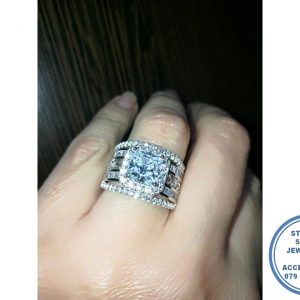 925 Sterling Silver Statement Designers Ring. 2 Baguette middle rows around center twirls and side cubic detail with large Halo Square Clear Cubic