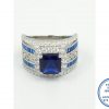 925 Sterling Silver Ring Showstopper Royal Blue Square Halo with 2 Blue Rows Baguette and curly inside detail with 2 clear side cubic detail. All as 1 Ring. Statement