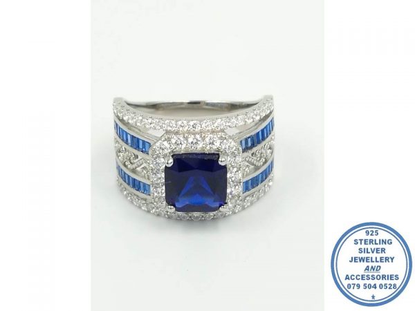 925 Sterling Silver Ring Showstopper Royal Blue Square Halo with 2 Blue Rows Baguette and curly inside detail with 2 clear side cubic detail. All as 1 Ring. Statement
